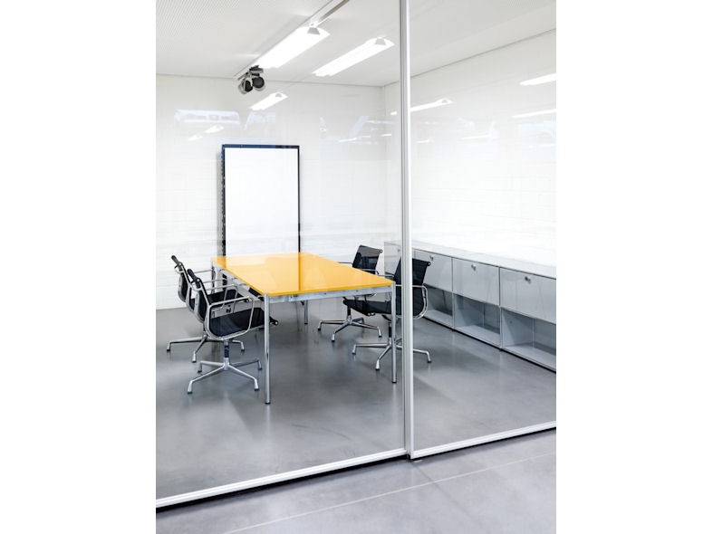 USM Haller Boardroom Table with a Laquered Glass Top